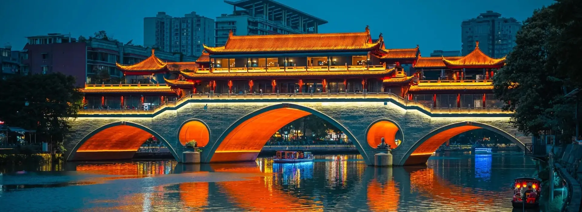 Anshun Covered Bridge night view over Jinjiang River in Chengdu